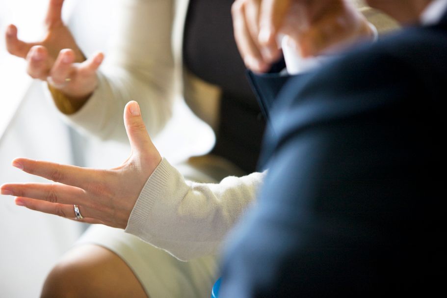 Woman's hands explaining something during a business meeting